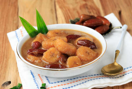 Kolak Pisang Kurma, Banana Compote with Dates Fruit, Popular Food beverages for Ifthar. Kolak Made from Coconut Milk and Palm Sugar with Various Topping like Sweet Potato, Pumpkin, Bananaの写真素材