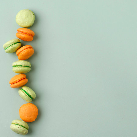 Top View Two Color macaroon isolated on Mint Color, Copy Sapce for Text, Recipe, or Advertisementの写真素材