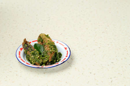 Stir Fry Cob Tuna Fish with Green Chilli (Tongkol Cabe Ijo), Indonesian Daily Food Recipe. Served on Enamel Plate, Copy Space for text. Selected Focusの写真素材