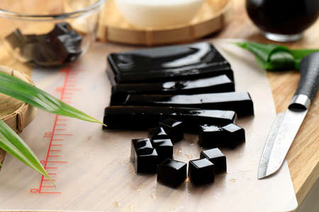 Selected Focus Cubed Black Grass Jelly (Cincau Hitam), Indonesian Dessert Made from Cincau Leaf with Coconut Milk and Palm Sugarの写真素材