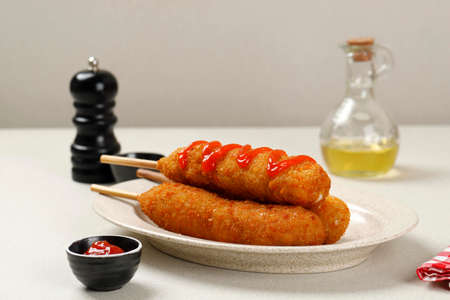 Organic CornDog  with Ketchup, Mayonaise, and Mustardの写真素材