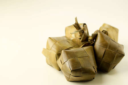 Ketupat, special dish served at Eid Mubarak or  Ied Fitr celebration in Indonesia. Ketupat is is a type of dumpling made from rice packed inside a diamond-shaped container of woven palm leaf pouch.の写真素材
