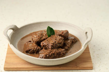 Empal Daging Kelem, Traditional Beef Stew from Central Java, Indonesia. Made from Beef, Coconut Milk, and Various Spices. Taste Sweet and Savory.の写真素材