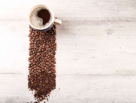 Espresso Coffee with Coffe Bean and Coarse Grinding Coffee, Copy Space for Text on White Wooden...