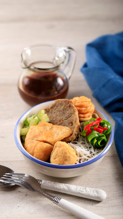 Pempek (Mpek-mpek) is Fish and Tapioca Served with Sweet and Sour Kuah Cuka (Cuko) or Vinegar Sauce. This Dish Popular from Palembang, Indonesia.の写真素材