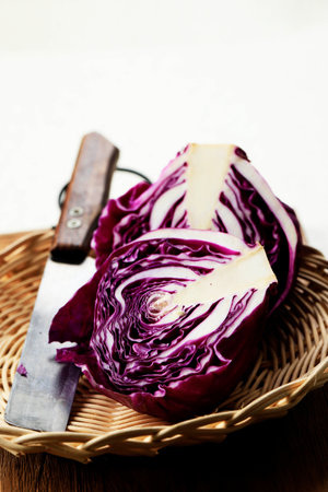 Close up Shredded, Sliced and a Whole of Purple Cabbage Vegetable on Top of Wooden Tableの写真素材