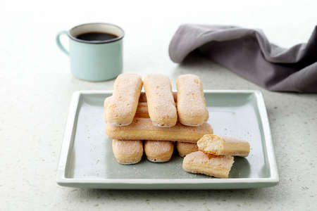 Italian Cookie Ladyfinger Savoiardi. Sweet Sponge Biscuits Cookies Tiramisu on white table.の写真素材