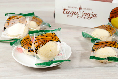 Bakpia Kukus Jogja or Bakpia Tugu, Steamed Mini Round Cake with Mung Bean Paste Inside. On White Tableの写真素材