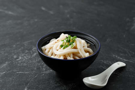 Iseudon Local Japanese Udon Noodle Cuisine with Thick Sauce, on Black Marble Table, Copy Space for Text or Advertisementの写真素材