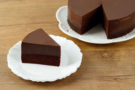 Slice of Homemade Chocolate Two Layer Brownie Pudding on Wooden Table, Copy Spaceの写真素材