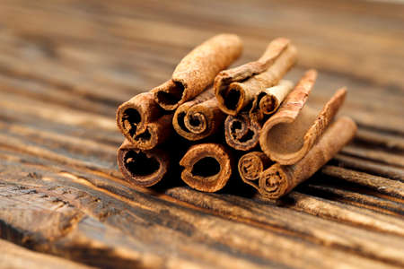 Isolated Cinnamon Stick on Wooden Background, Selected Focusの写真素材