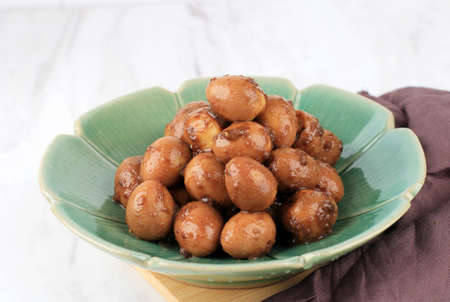 Homemade Delicious Stewed Braised Small Quail Eggs in a Plate for Eating, Close Up, Lifestyle.