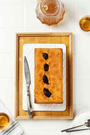 Top View Lapis Surabaya or Surabaya Layer Cake Served with Tea. Spiku is Three  Layers Rich Egg Yolk...