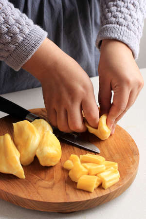Female Hand Process Take  Jackfruit Seeds, Step By Step Making Dessert in the Kitchen