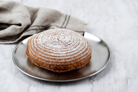 Boule Round Fresh Rustic Bread on Silver Plate, Copy Space for Text