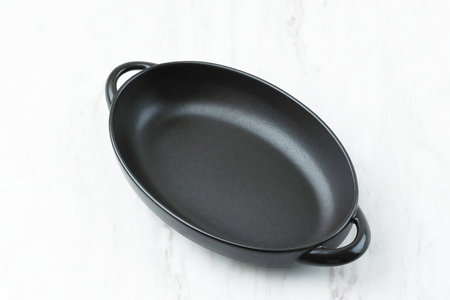 Empty Oval Black Dish on Marble Tableの写真素材