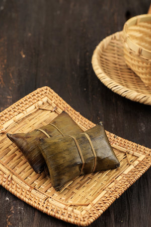 Burasa or Buras, Indonesian Rice Dumpling Cooked in Coconut Milk and Wrapped with Banana Leaf. Typical Traditional Food from Makasar, Sulawesi, Indonesia.の写真素材