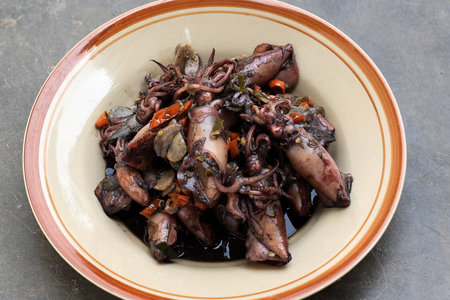 Squid Black Soup or Tumis Cumi Hitam. Stir Fried Squid in Black Ink, Indonesian Daily Traditional...