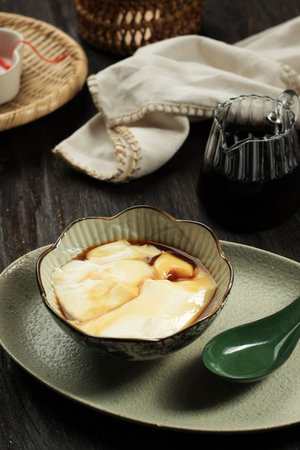 Tahwa or Wedang Tahu or Kembang Tahu, Indonesian Traditional Dessert made from Gingger and Palm...