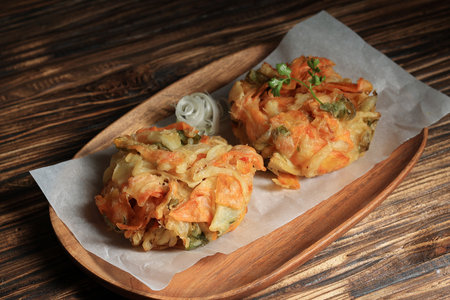 Two Kakiage Vegetable Fritter on Wooden Plate