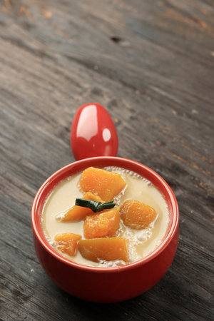 Kolak Labu Kuning, Yellow Pumpkin Compote. Popular Dessert for Ramaan Takjilの写真素材