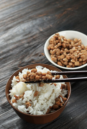 Natto over White Rice, on Wooden Tableの写真素材