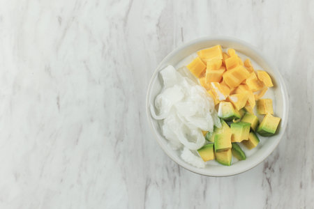 Es Teler or Es Teller, Popular Indonesian Fruit Cocktail Consist of Avocado, Young coconut, Jackfruit, Served with Simple Syrup and Condensed Milk.の写真素材