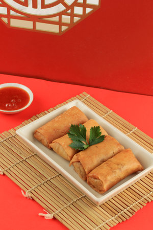 Chinese Lumpia or Vegetable Spring Roll with Sweet Spicy Sauce, Deep Fried Fritters Snack with Red...