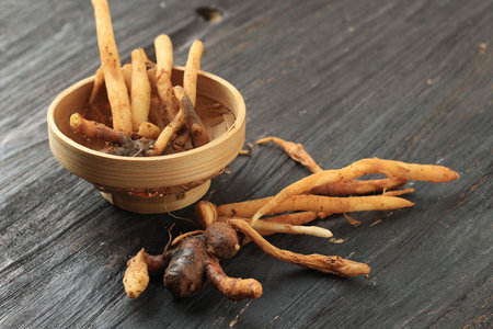 Finger Root on an Black Wooden Table. Asian Herbs and Spice