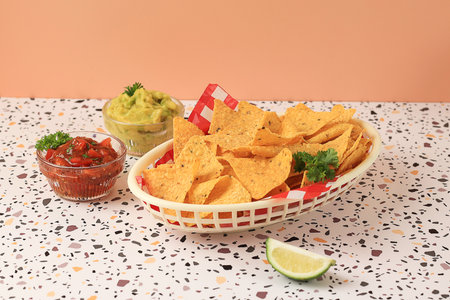 Mexican Nachos Tortilla Chips with Guacamole, Salsa, Lime. Copy Spaceの写真素材