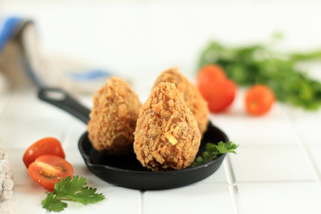 Coxinha Brazilian Snack, Deep Fried Batter with Shredded Chicken FIlling, on White Wooden Table