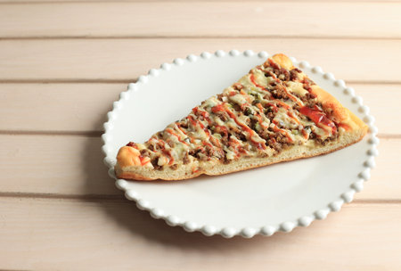 Big Slice Beef Pizza on White Plate
