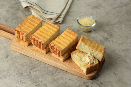 Roti Bakar Keju, Bandung Sandwich Bread Toast with Shredded Cheese. Popular Street Food from West...