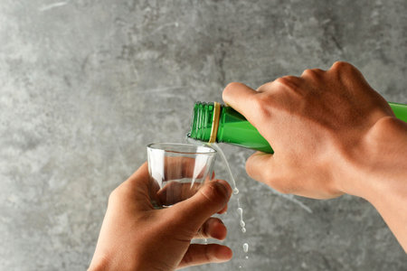 Mand Hand Pour Soju Korean Alcohol to the Sloki Glass, Copy Spaceの写真素材