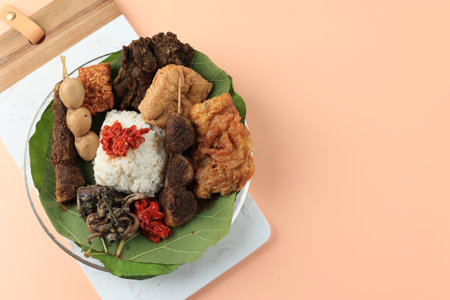 Sega Jamblang or Nasi Jamblang, Cirebon Original Rice Dish Wrapped with Teak Leaf with Various Side Dish, Sate Kentang, Tempeh, Sambal, Egg, Balakutakの写真素材