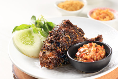 Famous Food in Madura, Indonesia Called Bebek Sinjay, Bebek is Duck, Consisting of Rice, Duck, Cucumber, Basil and Young Mango Chili.の写真素材