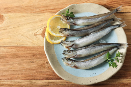 Frozen Capelin Shisamo Fish on Wooden Table, Top Viewの写真素材