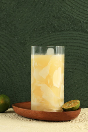 Es Kelapa Jeruk or Young Coconut with Squeezed Orange, Indonesian Tropical Refreshment Drink during...