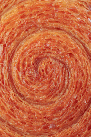 Round Puff Pastry Croissant New York Roll or Cromboloni Texture. Food Background