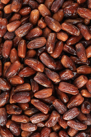 Full Frame Background Top View of Pile of Appetizing Honey Dried Date Kurma Tunisian Fruits Arranged...