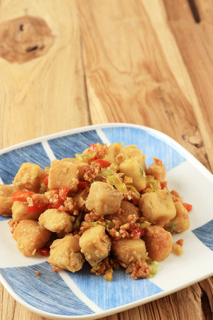 Tahu Cabe Garam or Salt and Pepper Tofu, Crispy Cubed Deep Fried Tofu with Garlic and Chilli Flakes. Popular as Tahu Lada Garamの写真素材