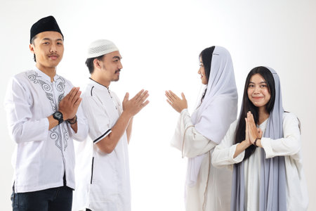 A Group of Asian People Friends Forgiving Each Other during Eid Mubarak Celebrationの写真素材