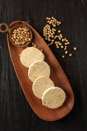 Top View Raw Round Tempeh, Fermented Soy Bean. Indonesian Traditional Food