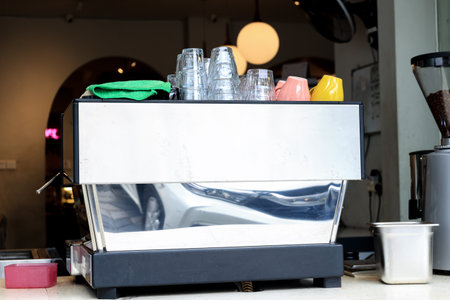 Big Espresso Machine in a Cafe with Glass and Cup on Topの写真素材