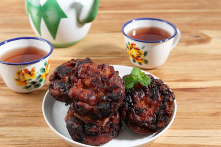 Honey Glazed Banana Fritter. Served with Tea on Wooden Tableの写真素材