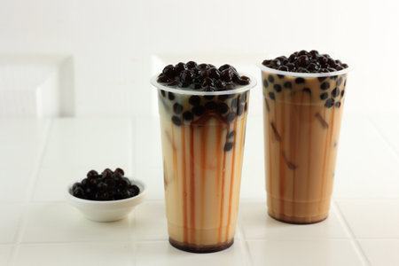 Two Plastic Cup of Taiwan Boba Milk Tea on White Backgroundの写真素材