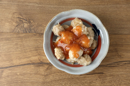 Bakso Pentol Solo Served with Spicy, Sour, and Sweet Sauce. Street Food Meatball Made from Starch and Chicken.の写真素材