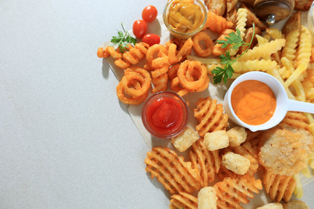 Top View of Assorted Crispy Chips and Potatoes with Copy Space for Textの写真素材