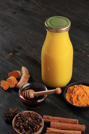 Turmeric Drink or Jamu Kunyit Asam, Popular Indonesian Traditional Drink for Detox, Diet, and Immunity Boosting. Made from Turmeric and Asam Jawa Tamarindの写真素材