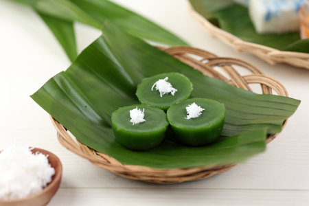 Kue Lumpang Pandan or Kue Ijo,  Indonesian Traditional Steamed Green Cake with Chewy Texture, Served with Grated Coconut. Popular Jajanan Pasar from Indonesiaの写真素材